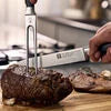 ZWILLING Four Star 2-pc, Slicing/Carving Knife And Fork Set Sleek, polypropylene handles are crafted with a minimum amount of 75% recycled plastics.