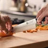 ZWILLING Gourmet 8-inch, Chef's Knife Traditional, triple-riveted handle with a laser-inscribed logo provides balance and stability.