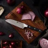 ZWILLING Pro 5.5-inch, Hollow Edge Santoku Knife Designed to be an extension of your hand encouraging cutting with improved precision, safety and comfort.