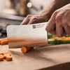 ZWILLING Gourmet 6-inch, Cleaver Traditional, triple-riveted handle with a laser-inscribed logo provides balance and stability.