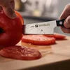 ZWILLING Gourmet 5.5-inch Prep Knife, Fine Edge Traditional, triple-riveted handle with a laser-inscribed logo provides balance and stability.
