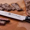 ZWILLING Gourmet 8-inch, Slicing/Carving Knife Traditional, triple-riveted handle with a laser-inscribed logo provides balance and stability.
